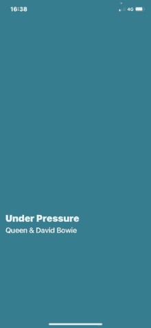 a phone screen shows a song called under pressure