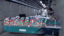 a green container ship with the word evergreen on the side of it