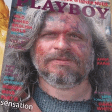 a man with long hair and a beard is on the cover of playboy magazine