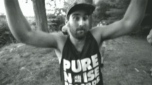 a man wearing a shirt that says pure noise on it