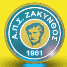 a blue and yellow circle with a man 's head and the year 1961