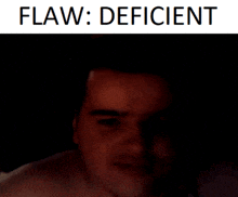 a man 's face is shown in a dark room with the words flaw : deficient below it