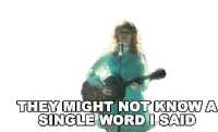 a woman is singing into a microphone while holding a guitar and they might not know a single word i said