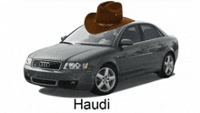 a cowboy hat sits on top of an audi