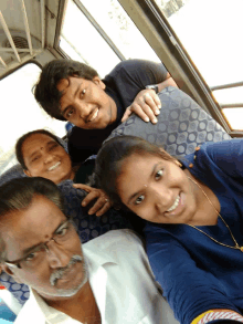 a group of people are posing for a picture together