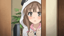 a girl wearing a panda hoodie is peeking out of a doorway