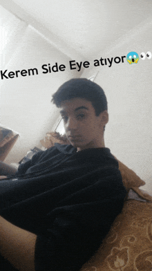 a boy laying on a couch with the words kerem side eye atiyor written on the bottom