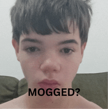 a close up of a person 's face with the words " mogged " written below it