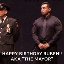 two men standing next to each other with the words happy birthday ruben aka " the mayor "