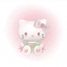 a hello kitty doll is sitting on a pink background and has a bow on her head .