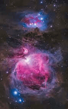 a purple and blue nebula in the night sky