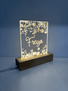 a lighted sign with the name freya written on it