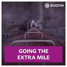 an ad for evonik shows a man in a hard hat going the extra mile