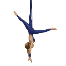 a woman in a blue leotard is doing a handstand on a white background