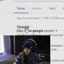 a woman wearing headphones stands in front of a microphone in front of a google website