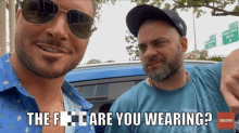 two men standing next to each other with the words " the f are you wearing " on the bottom