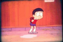 a cartoon boy is standing in front of a wooden wall and holding a baseball bat .