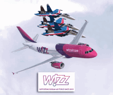 a wizz airplane is flying in the sky with fighter jets in the background