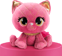 a pink stuffed animal with big eyes and a gold collar sits on a pink surface