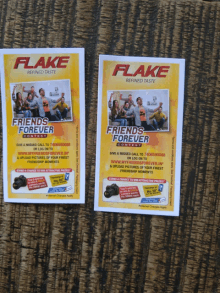 two flyers for flake are sitting on a table