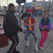 a group of people are dancing on a sidewalk in front of a store that says ' coca cola ' on it