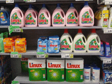 a row of bottles of linux laundry detergent on a shelf