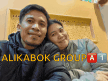 a man and a woman are posing for a picture with the words alikabok group a1 written on the bottom