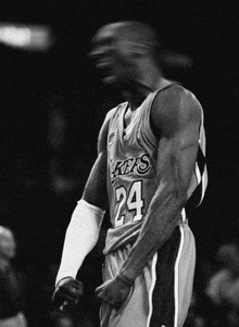 a black and white photo of a lakers player number 24