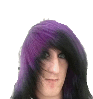 a person with purple and black hair is making a funny face .