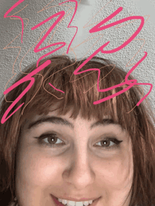 a close up of a woman 's face with pink scribbles on it