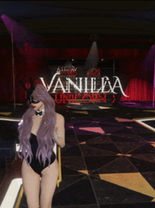 a woman in a bunny suit is standing in front of a sign that says " vanilla unicorn "