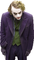 the joker is wearing a purple suit and holding a knife