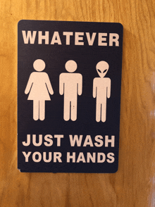 a sign on a door says whatever just wash your hands