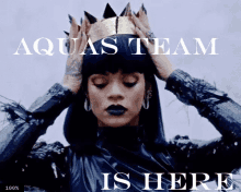 a poster of a woman wearing a crown with the words aquas team is here