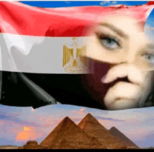 a woman 's face is visible behind a egyptian flag