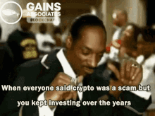 a man in a suit and tie says when everyone said crypto was a scam but you kept investing over the years ..