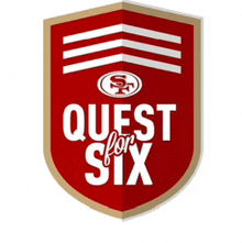 a red shield with the word quest on it