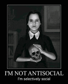 a poster of wednesday addams holding a skull says i 'm not antisocial