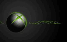 a black xbox ball with a green x on it is surrounded by green lines on a black background .