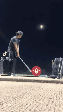 a tik tok video of a man swinging a golf club at a ball