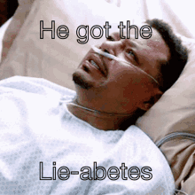 a man is laying in a hospital bed with a caption that says " he got the lie-abetes "