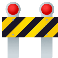 a yellow and black striped sign with two red lights