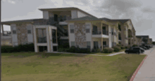 a large apartment building with a green roof