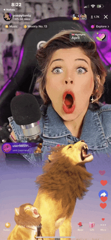 a phone screen shows a woman with her mouth open and a stuffed lion behind her