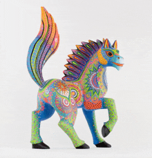 a colorful statue of a horse with a rainbow tail