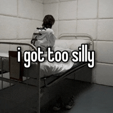 a woman in a straight jacket is sitting on a bed with the words " i got too silly " written above her