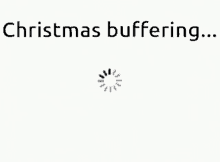 a white background with the words `` christmas buffering ... '' and a loading spinner .