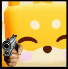 a person is holding a gun in front of a yellow cube with a sad face .