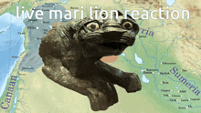 a statue of a lion with the words live mari lion reaction on the bottom