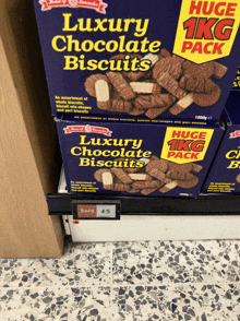 a box of luxury chocolate biscuits sits on a shelf in a store